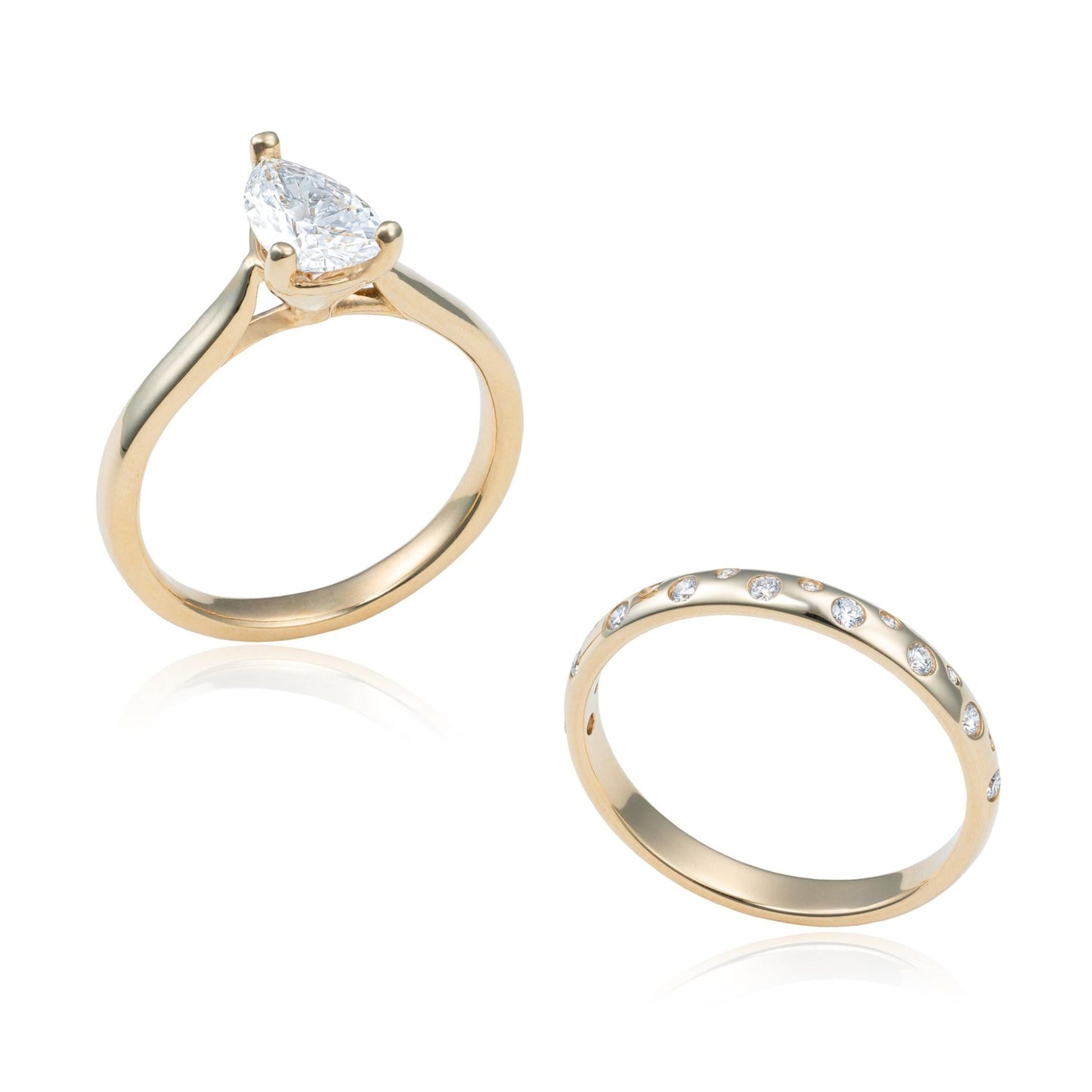 Pear Shaped Solitaire Diamond Wedding Set with Scattered Diamond Gypsy Band in 14K Yellow Gold